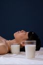 Woman in White Tank Top Lying on Bed