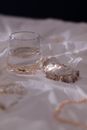 Clear Drinking Glass on White Textile