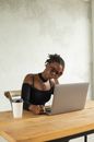 Woman in Black Tank Top Using Macbook