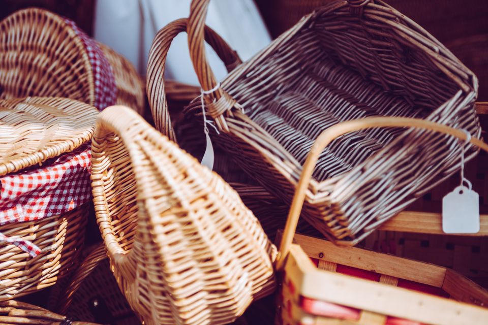 A run of finished willow baskets stacked along the bench — photo by Clem Onojeghuo on Pexels