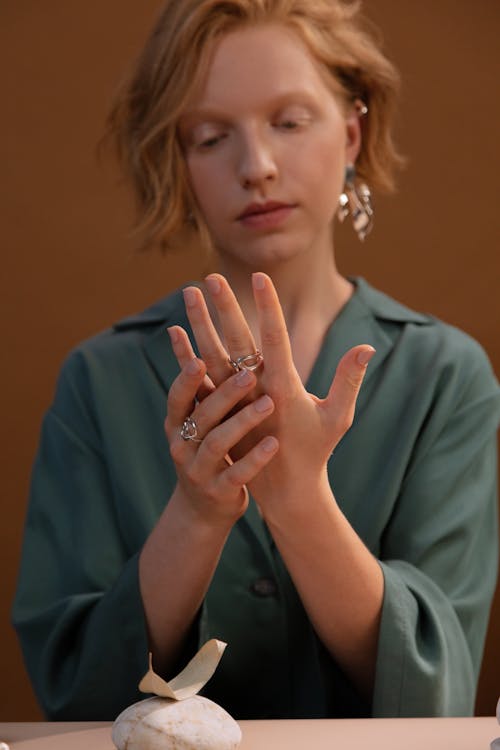 Photo of a Woman Putting on a Ring