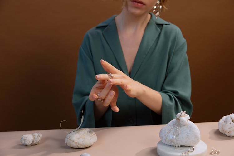 Woman Trying On A Silver Ring