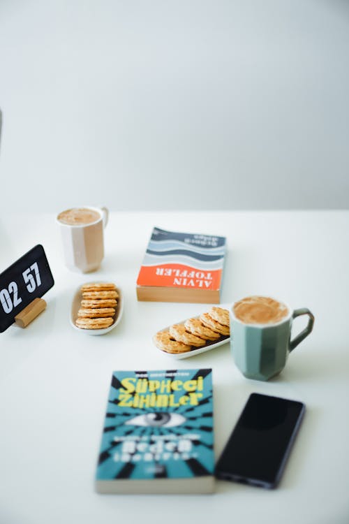 Free Books and Snacks on Table Surface  Stock Photo