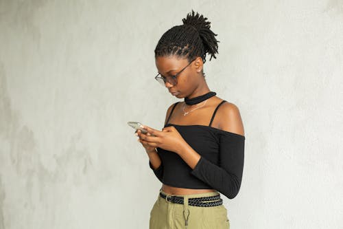 Black smart woman using smartphone