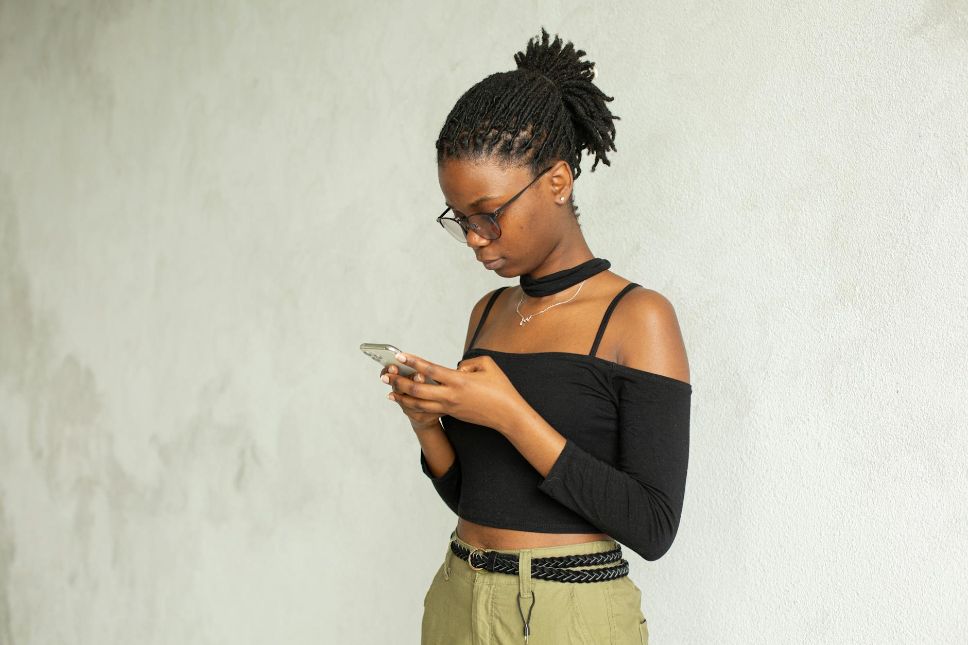 Black smart woman using smartphone