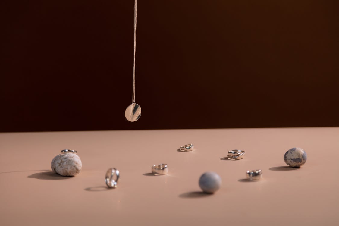 White and Silver Baubles on White Table