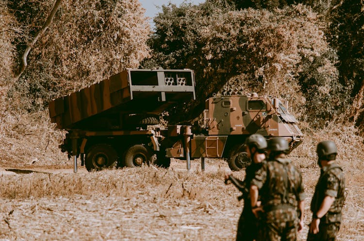 Men Standing Near A Military Truck