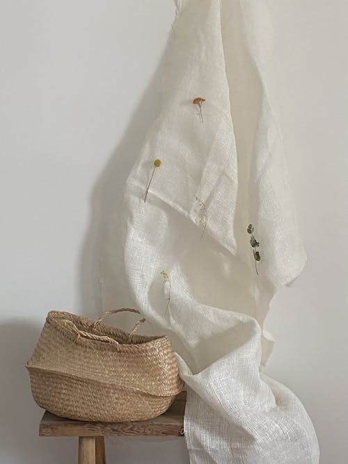 Wicker Basket beside a Textile 
