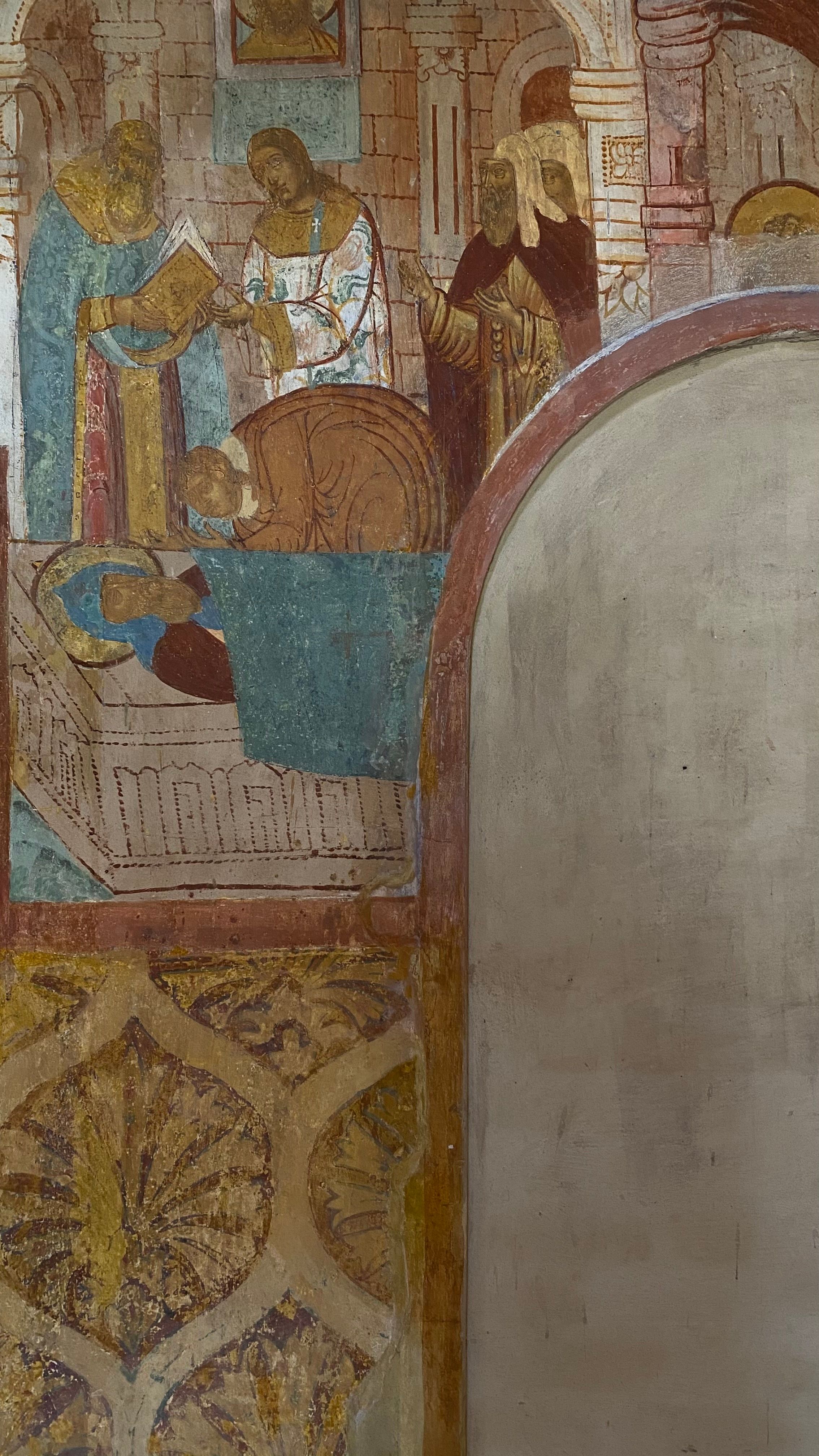 Close-up of historical religious mural with intricate architectural details.