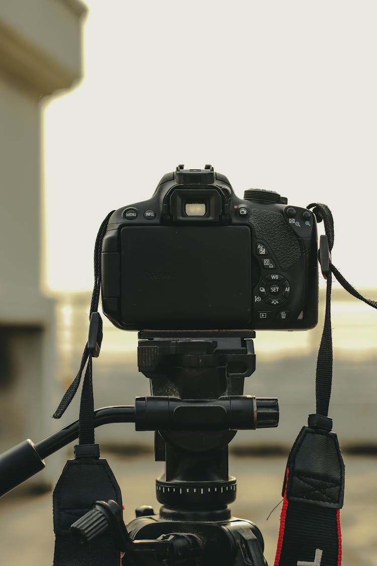 Black Dslr Camera On Tripod