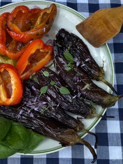 Cubed eggplant roasted at high heat with garlic, olive oil, and fresh herbs until deeply caramelized and tender.