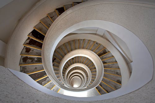 Brown Spiral Staircase With Brown Wooden Railings