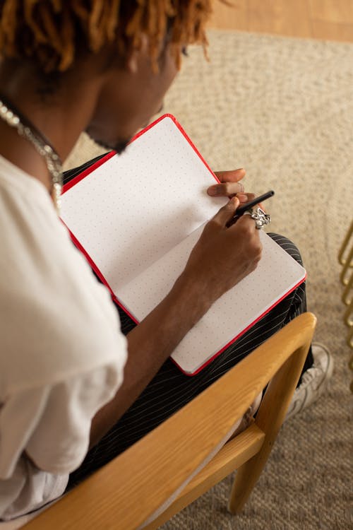 Person Holding White Printer Paper