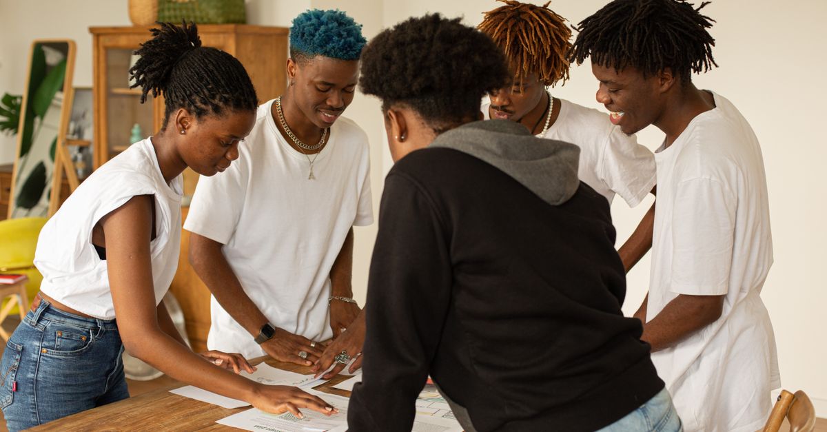 Christ Embassy Ho team members engaging with local youth in a workshop setting