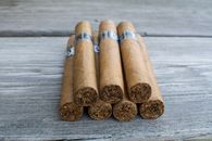 Cigars on Wooden Surface