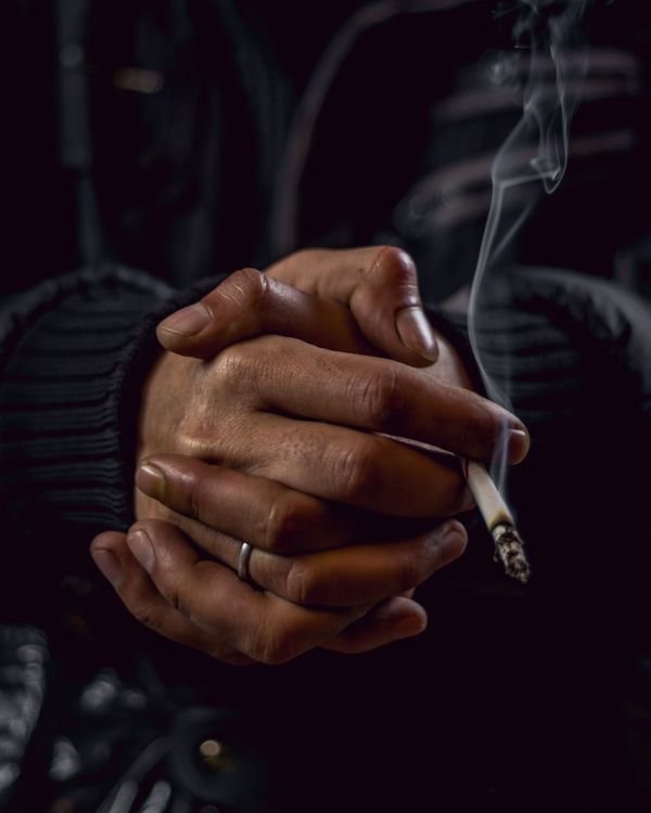 Cloe-up Photo of Person holding Lightened Cigarette · Free Stock Photo