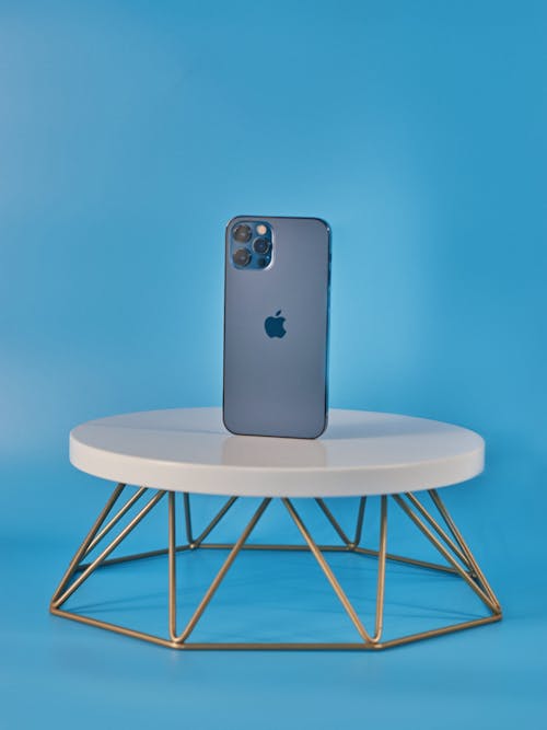 Free Iphone on a White Table  Stock Photo