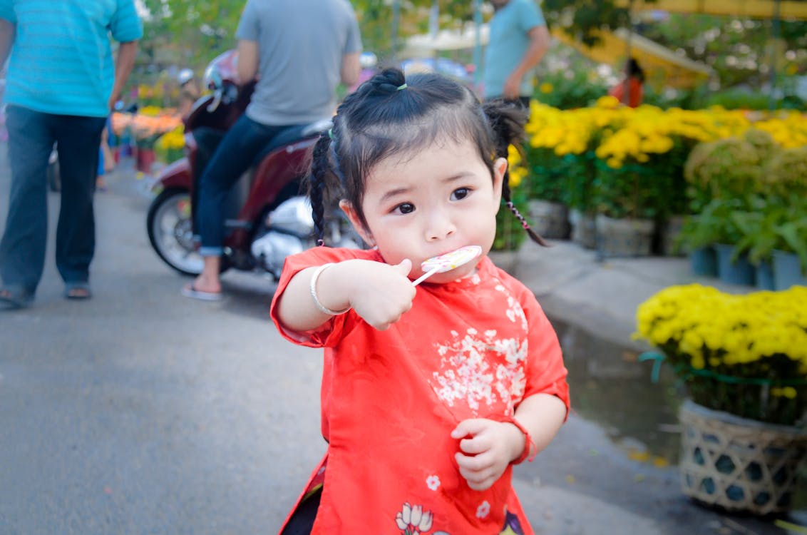 Free Girl Eating Lollipop Stock Photo