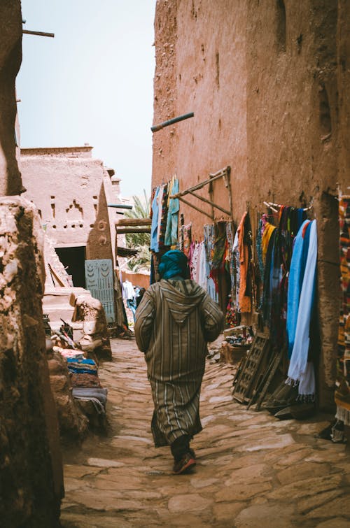 Free Photo of a Woman Passing Through the Alley  Stock Photo