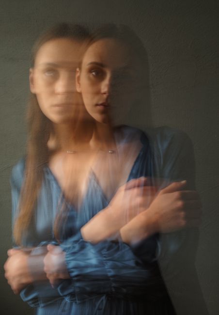 Portrait of a woman with motion blur creating a dreamy effect.