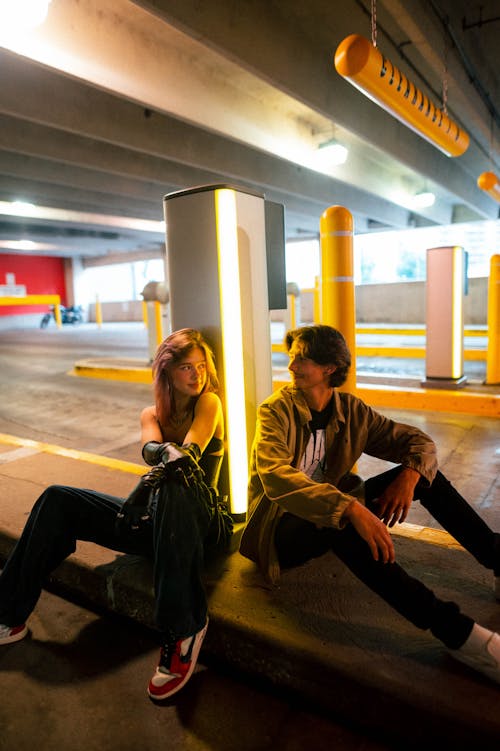 Woman and Man Sitting in Car Park