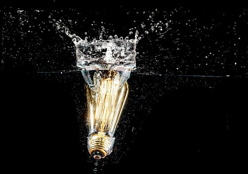 Free Photography of Light Bulb on Body of Water Stock Photo