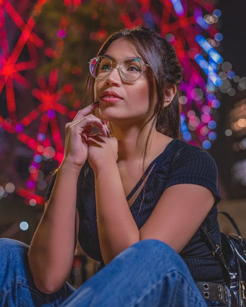 A Woman in Black Shirt and Blue Denim Jeans