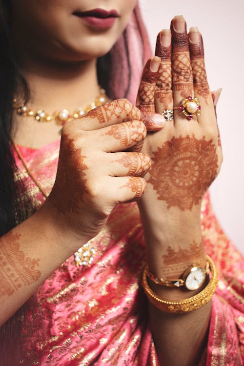 Woman Hands with Henna Tattoos