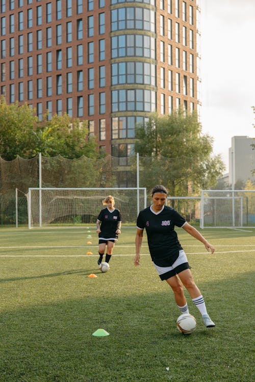 Free Women Athletes playing on Field  Stock Photo