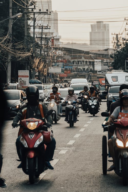 Photograph of a Road with Motorcycles and Cars