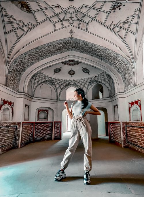 Free A woman poses confidently in an intricately designed historic interior, showcasing cultural heritage. Stock Photo