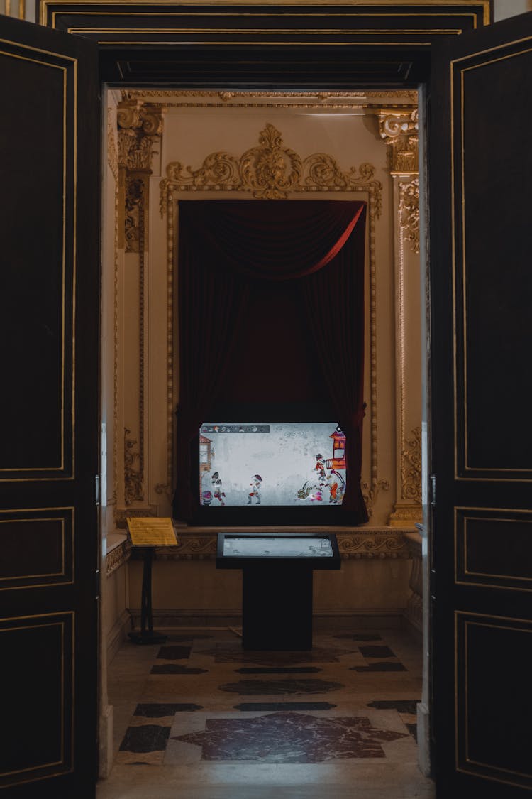 Museum Interior With Golden Wall Decoration And Screens