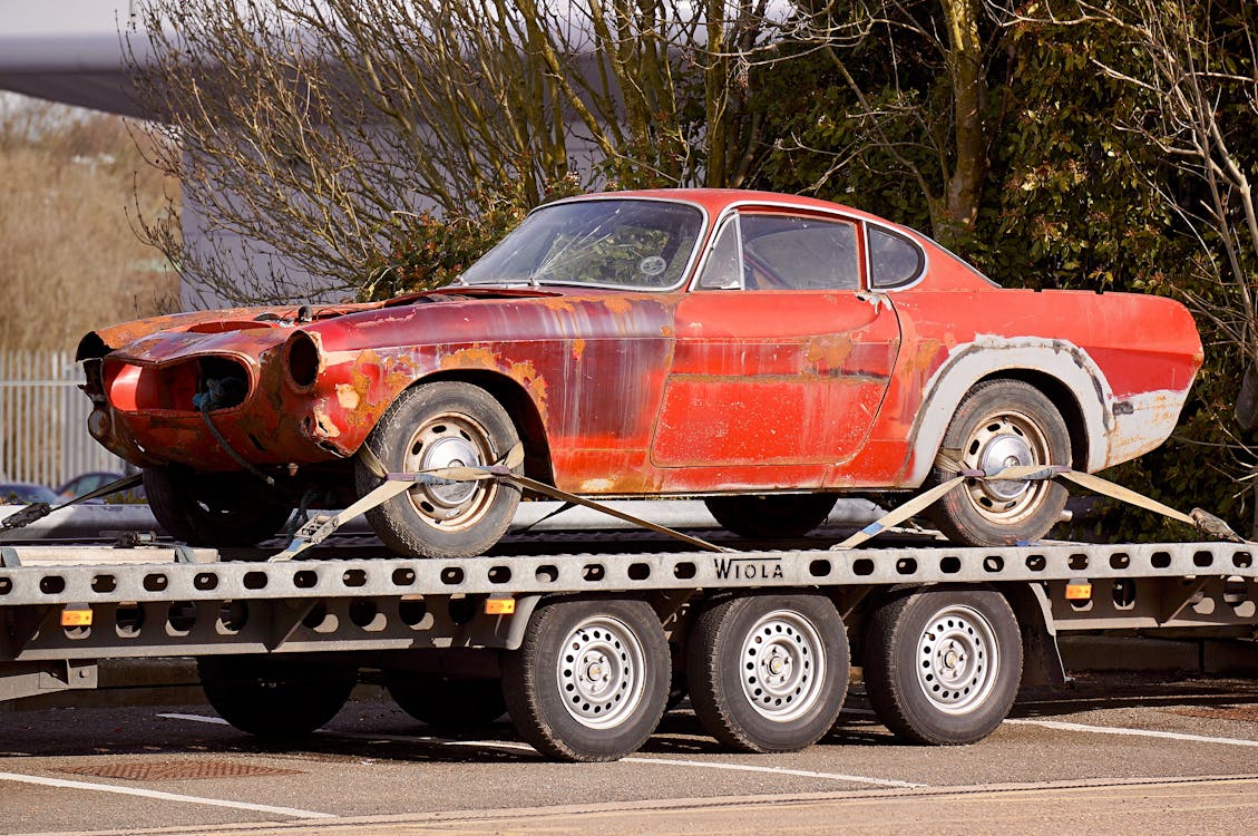 Free Red Coupe on Flatbed Trailer Stock Photo