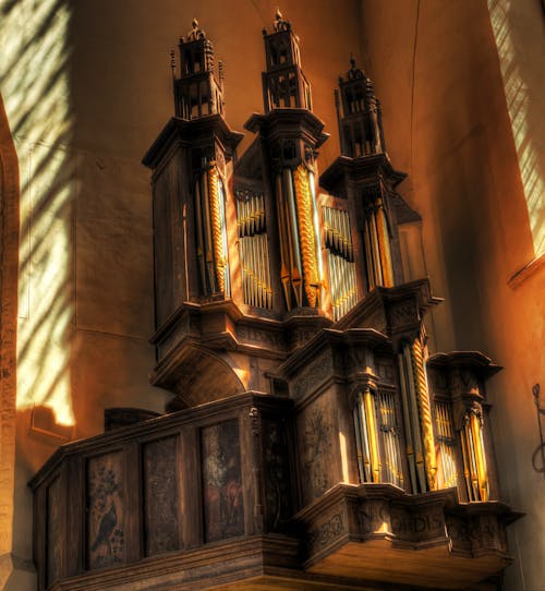 Brown and Beige Pipe Organ in Corner