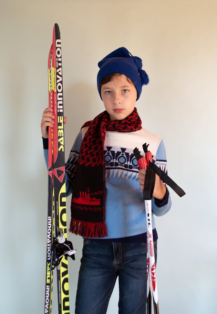 Boy Holding Skiing Equipment