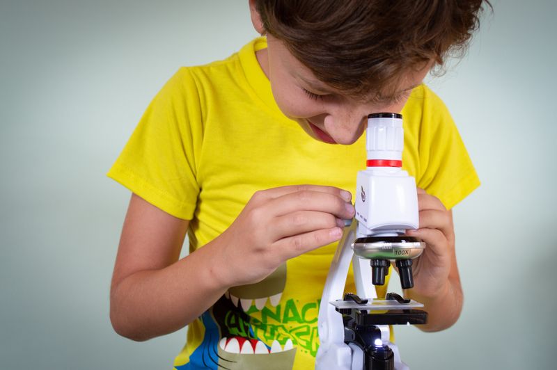 Young learner exploring science with a microscope
