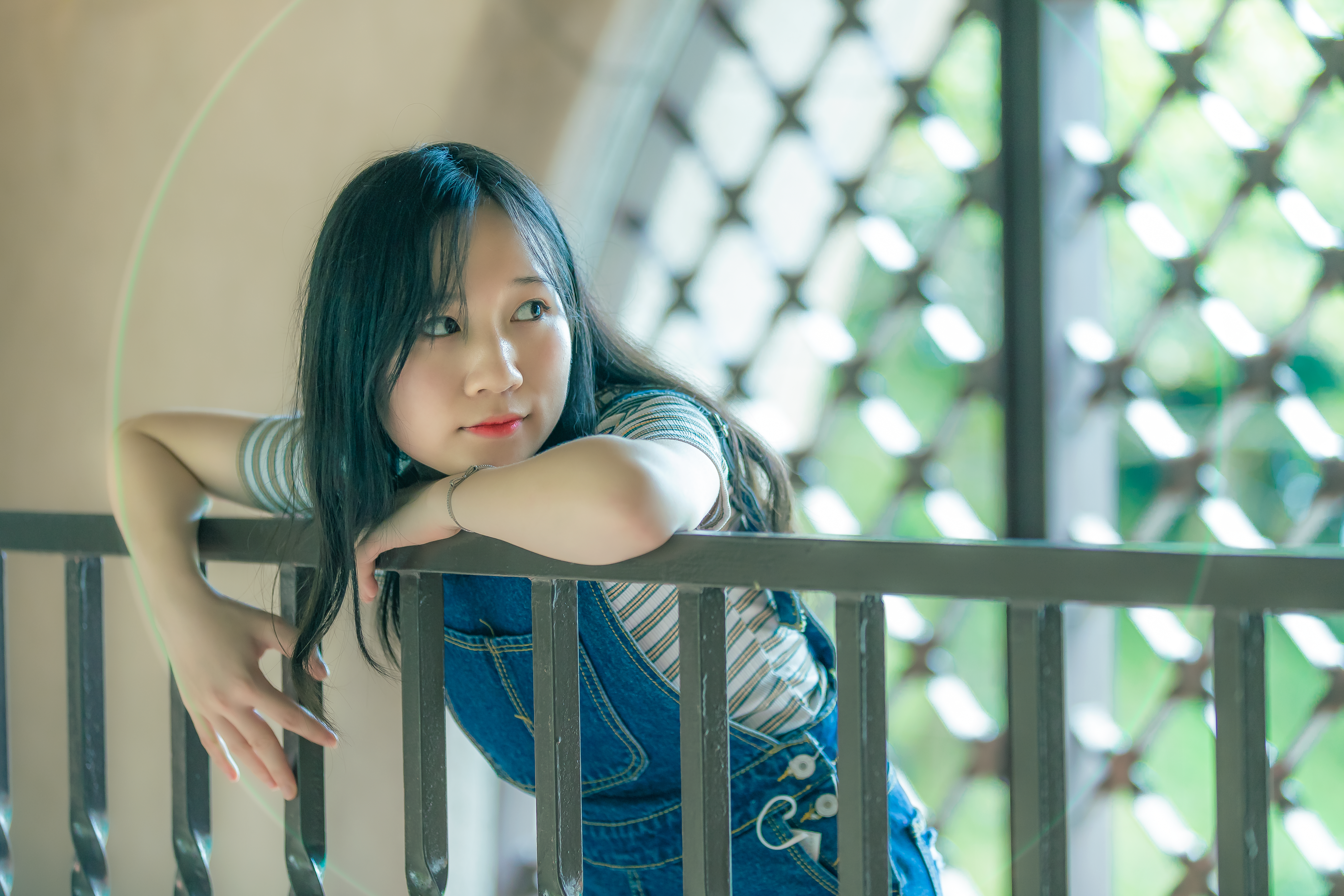 A Woman Leaning against a Railing · Free Stock Photo