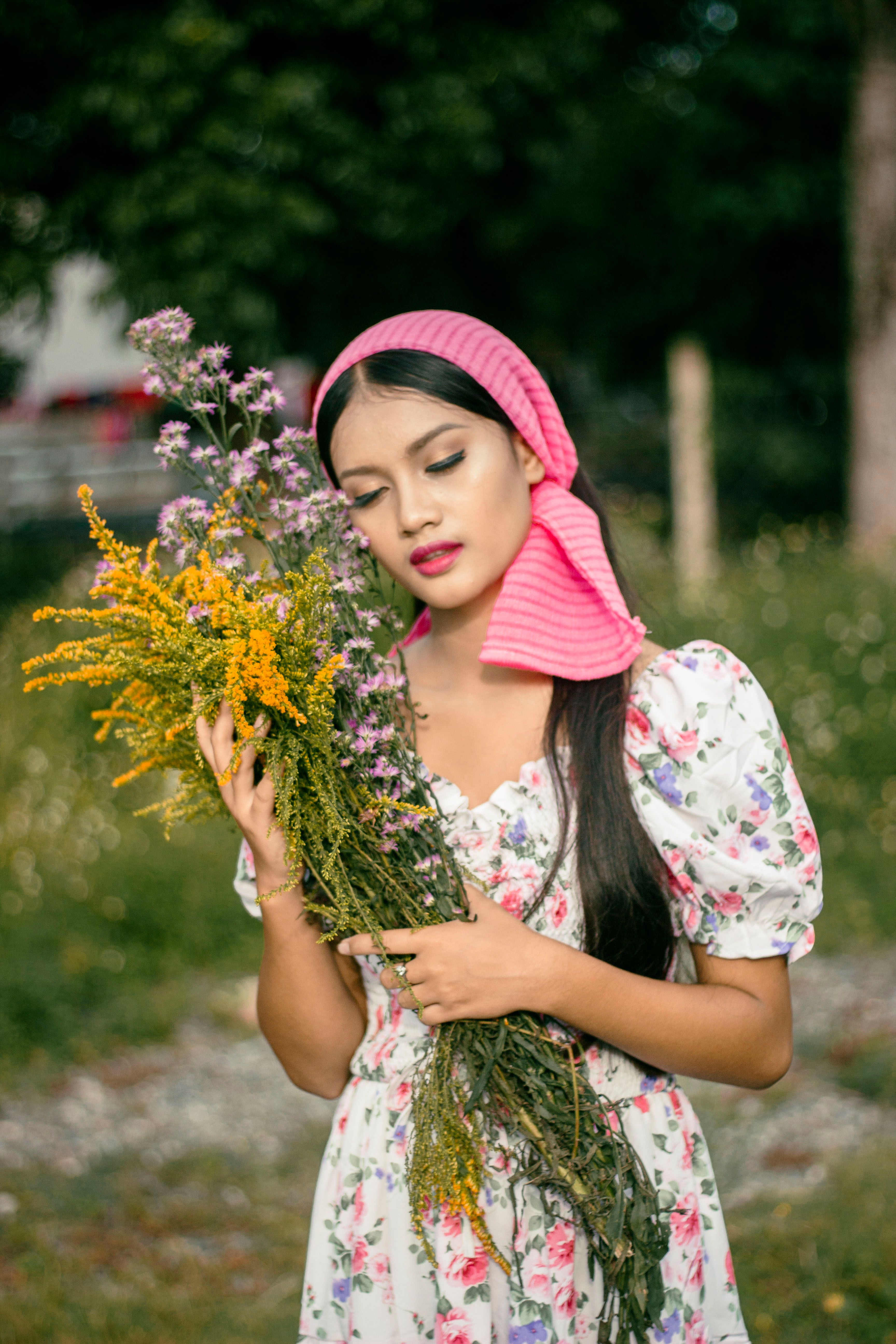 Woman in White and Pink Floral Dress Holding Bouquet of Flowers · Free ...