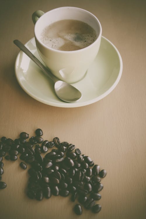 Безкоштовне стокове фото на тему «блюдце, Кава, кавові зерна»