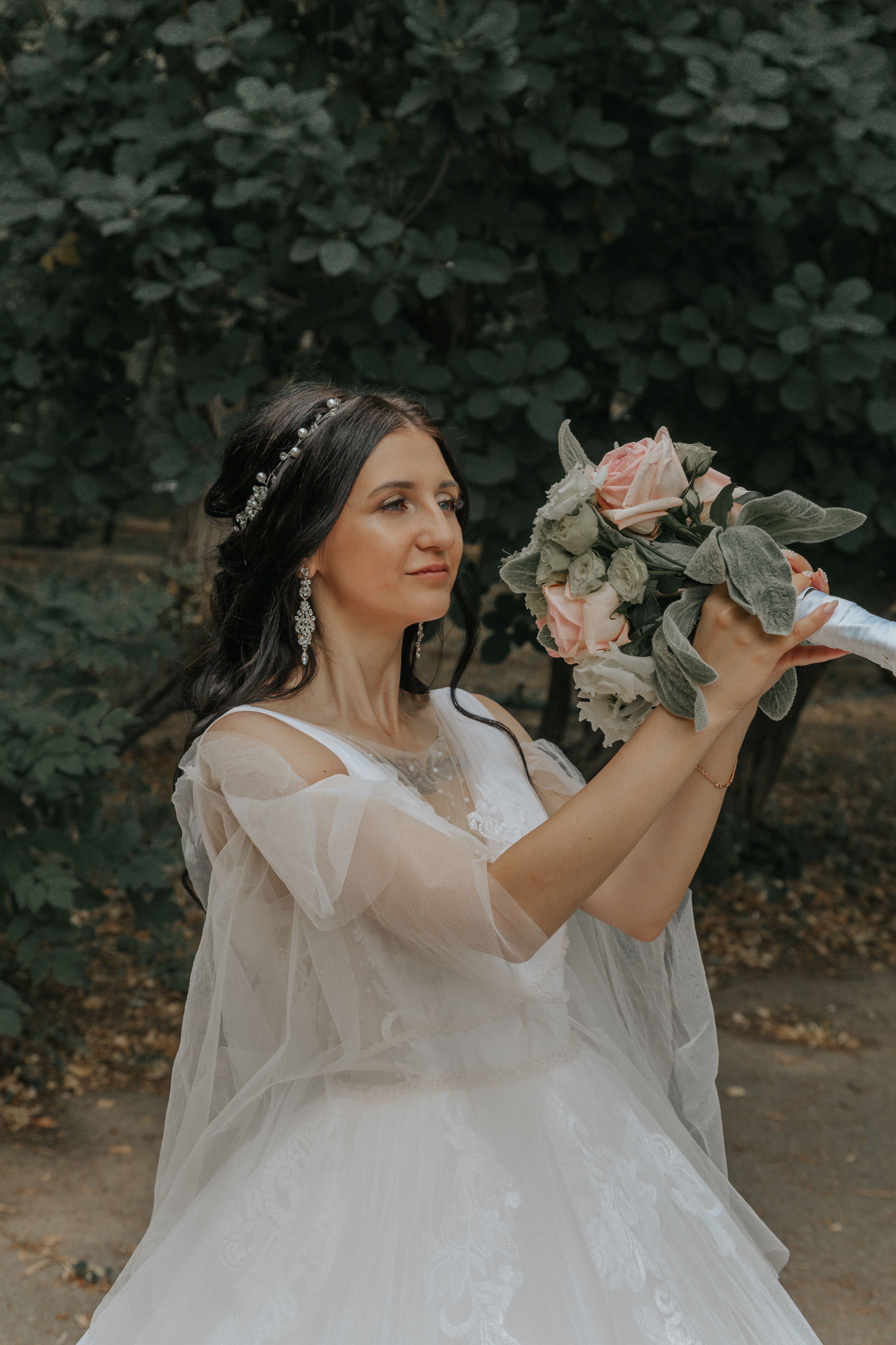 Woman Wearing a White Dress Holding Bouquet of Flowers · Free Stock Photo