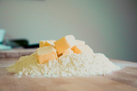 Flour and Butter on Wooden Table