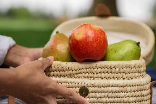 Selective Focus Photo of a Basket with Ripe Fruits