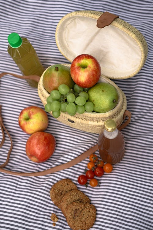 Green and Red Apples on Brown Woven Basket