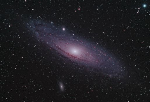 Capture of the Andromeda Galaxy surrounded by countless stars in a serene night sky.