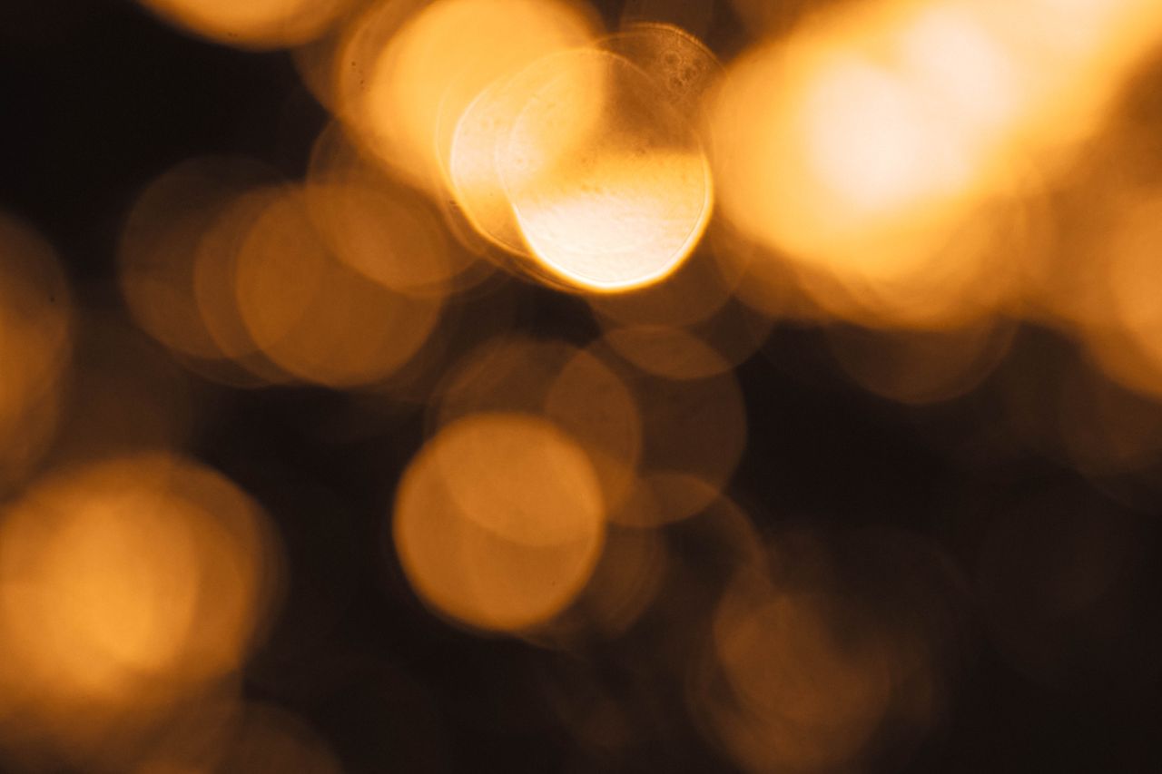 a captivating abstract image showcasing golden bokeh lights creating a