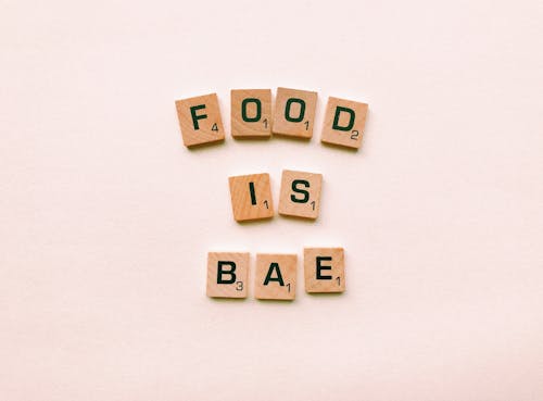Free Food Is Bae Wooden Decor Stock Photo