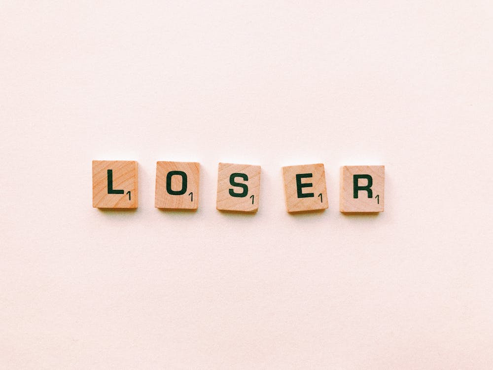 Closeup Photography of Loser Scrabble Letter