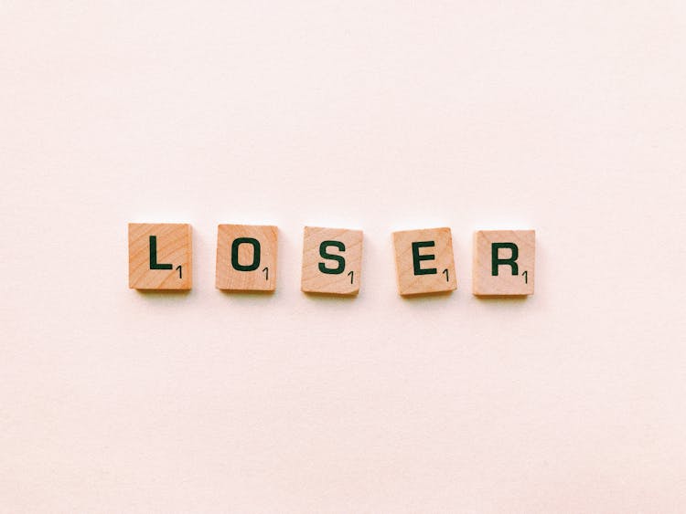 Closeup Photography Of Loser Scrabble Letter