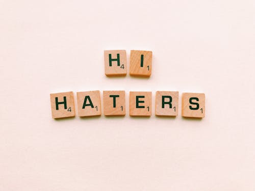 Free Hi Haters Scrabble Tiles on White Surface Stock Photo