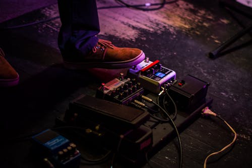 Free Person Operating Guitar Effects Pedal Stock Photo